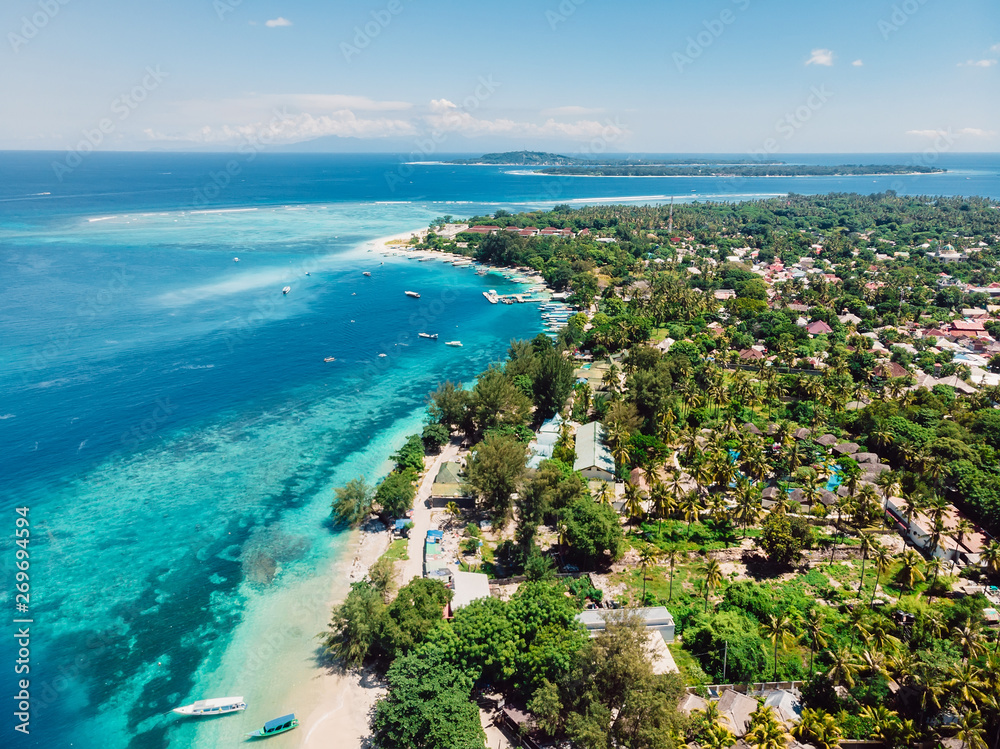 Beautiful tropical island with turquoise crystal ocean, aerial view. Gili islands