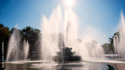 fountain in the city park, hot day.
