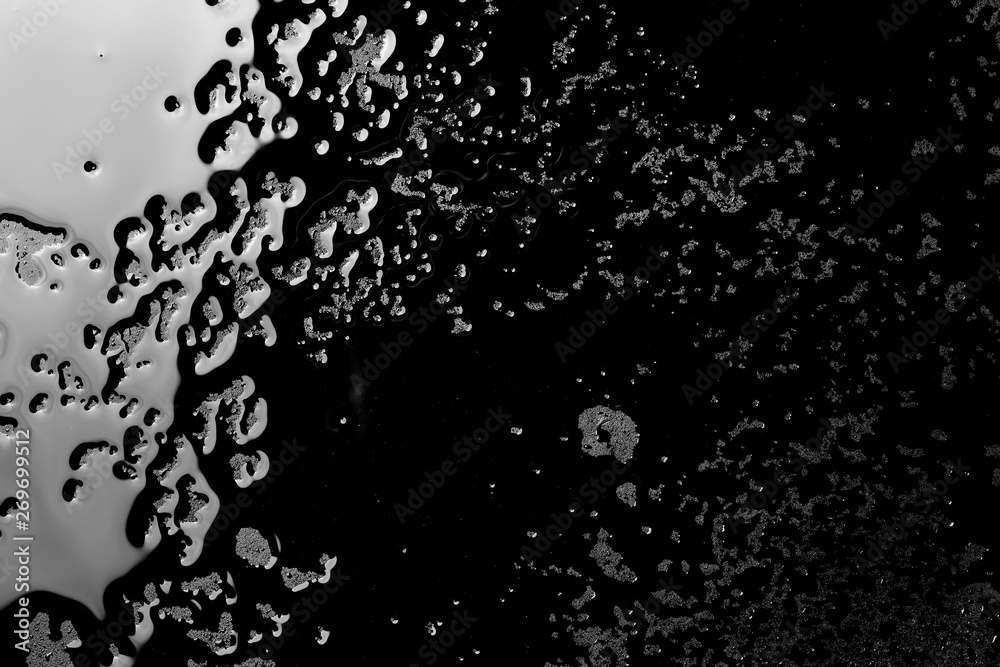 Water droplets on black background and  texture, top view