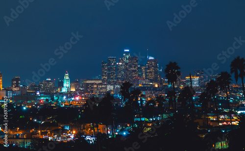 Wallpaper Mural Downtown Los Angeles skyline at night with palm trees in the foreground Torontodigital.ca