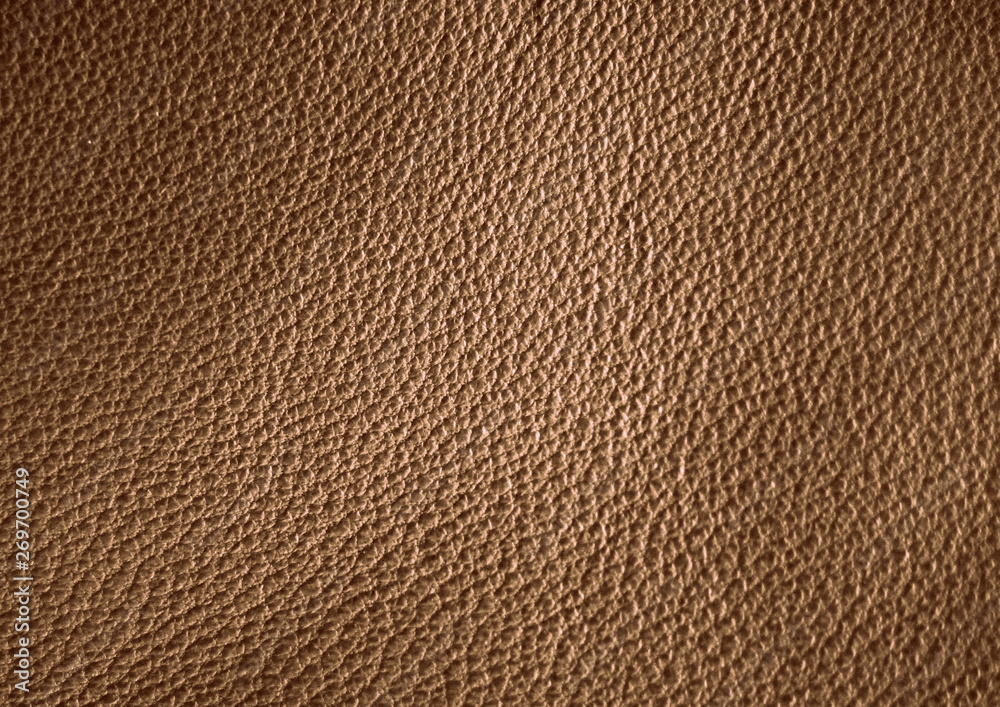 Texture of genuine leather. Brown color background. Texture of genuine leather. Brown color background.