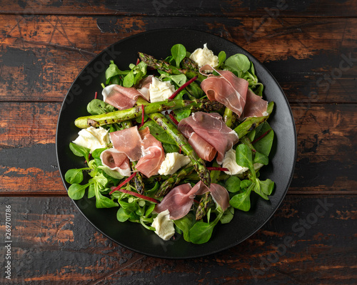 Grilled Asparagus, parma ham salad with mozzarella cheese and green vegetables