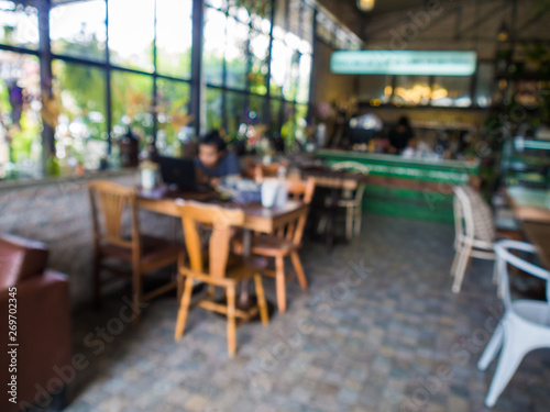 Blurred indoor coffee shop with busy people