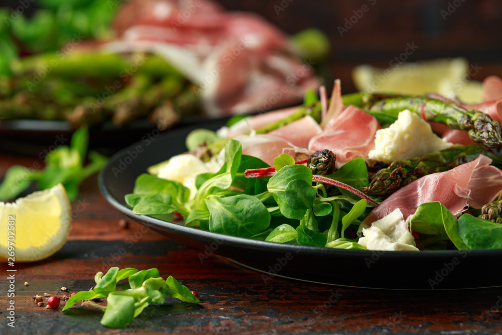 Grilled Asparagus, parma ham salad with mozzarella cheese and green vegetables