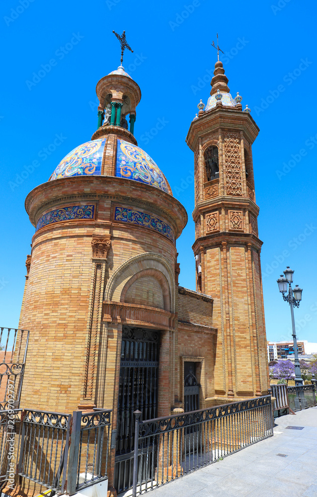Fototapeta premium The Castle of San Jorge was a medieval fortress built on the west bank of the Guadalquivir river in the city of Seville .