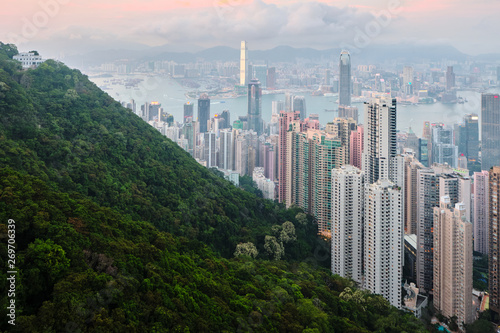 Intersting view of green peak and Hong Kong cityscape at sunset