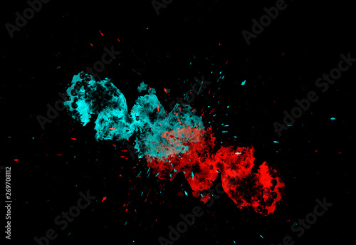 Freeze motion of colorful paint explosion on black background.