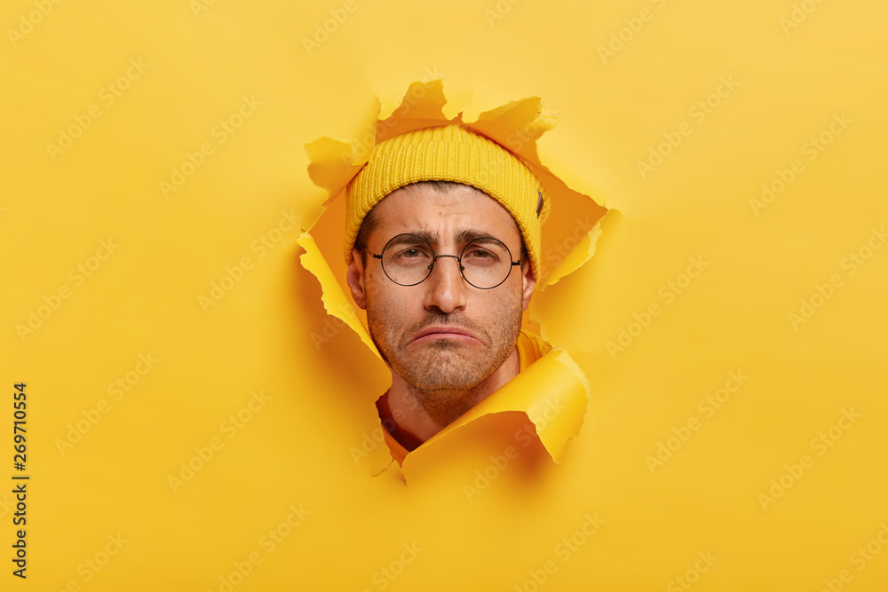Gloomy dissatisfied Caucasian man smirks face from negative emotions ...