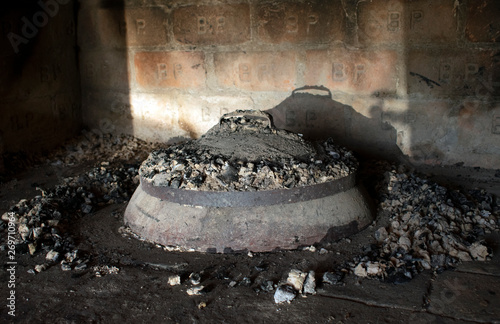 Iron pan, iron bell, peka - Traditional balkans food preparation - Covered in ash