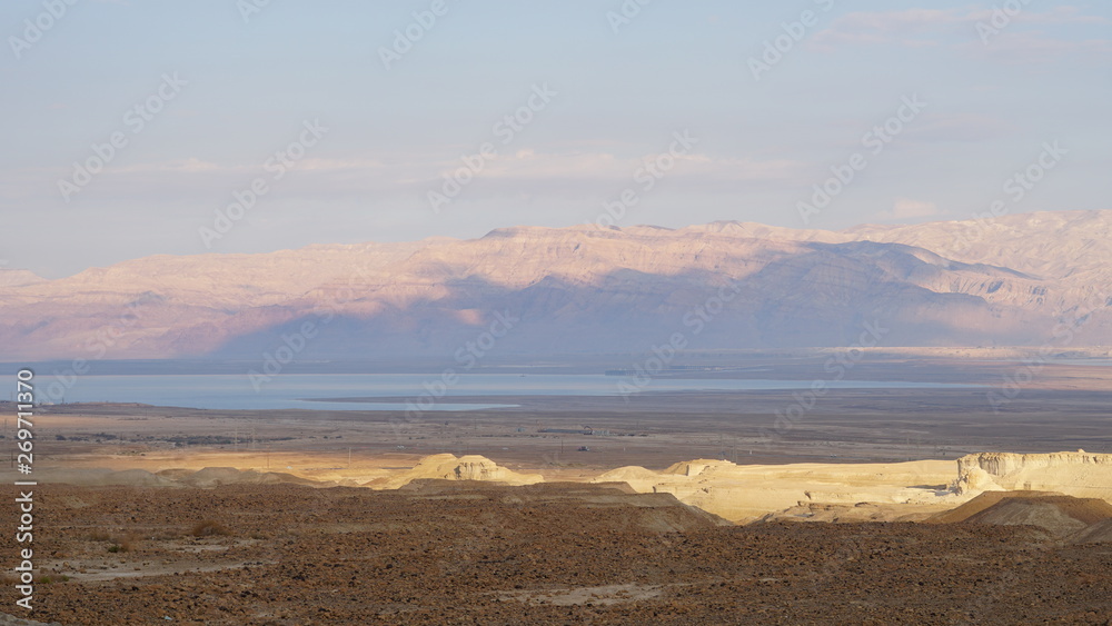 Landscape with Dead Sea and palm in Israel at sunset.