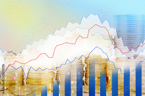 Double exposure of city, Stock market and graph on rows of coins for finance and banking , investments, trading, chart, Digital economy concept. photo