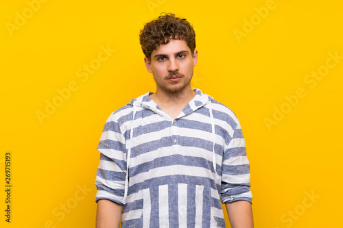 Wallpaper Mural Blonde man over yellow wall portrait Torontodigital.ca