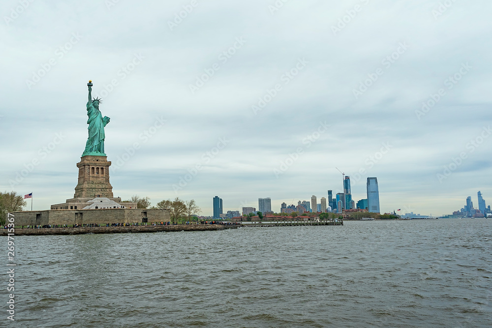 USA, New York - May 2019: Statue of Liberty, Liberty Island, with Manhtattan in the background USA, New York - May 2019: Statue of Liberty, Liberty Island, with Manhtattan in the background