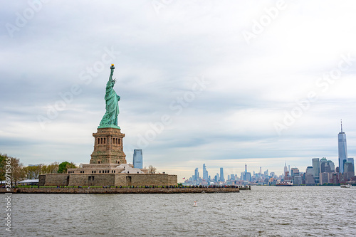 USA, New York - May 2019: Statue of Liberty, Liberty Island, with Manhtattan in the background