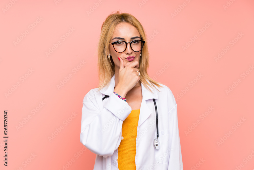 Young blonde doctor woman thinking an idea