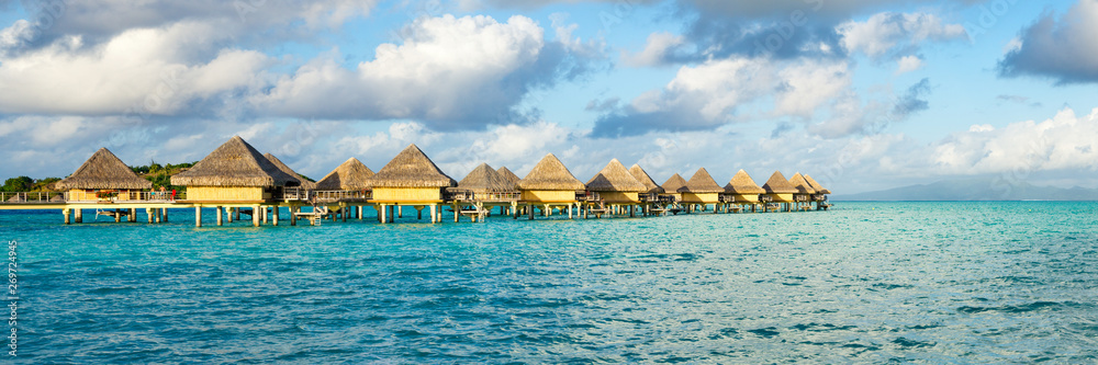 Overwater bungalows at a luxury beach resort in the tropics
