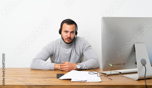 Telemarketer Colombian man with sad and depressed expression
