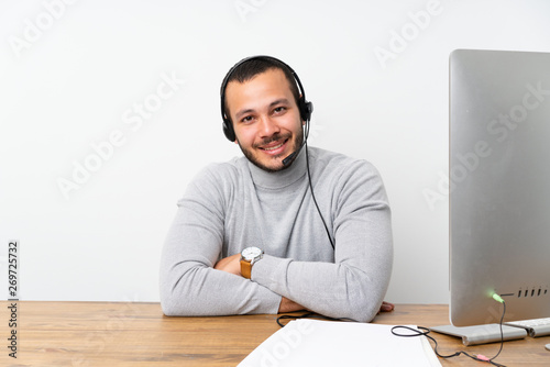 Obraz na płótnie Telemarketer Colombian man working in a office