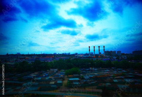 Four industrial chimneys at Moscow bokeh background hd