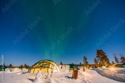 Northern lignt in Finland over Igloo house  photo