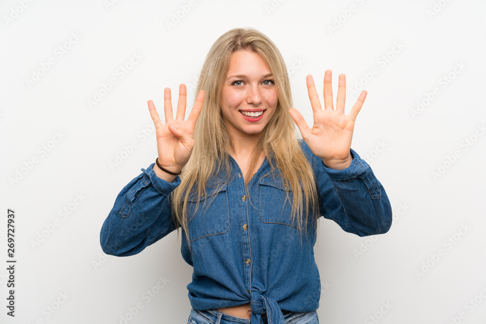 Young blonde woman over isolated white wall counting nine with fingers Young blonde woman over isolated white wall counting nine with fingers