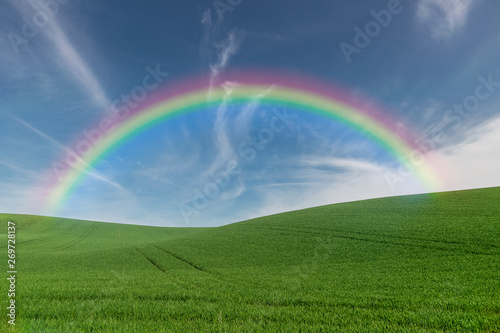 Summer farmland with rainbow