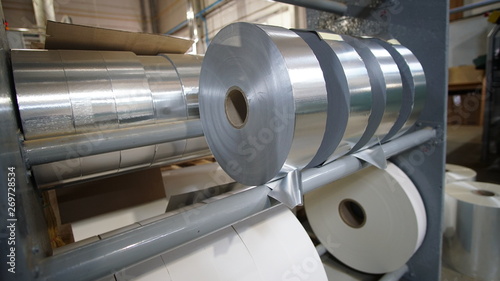 Shiny foil rolls for cigarettes packing in a tobacco factory