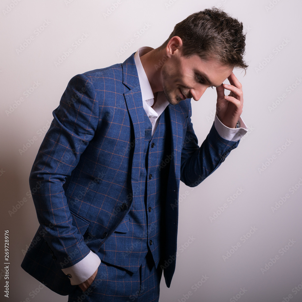 Elegant young handsome man in stylish blue costume. Studio fashion portrait. Elegant young handsome man in stylish blue costume. Studio fashion portrait.