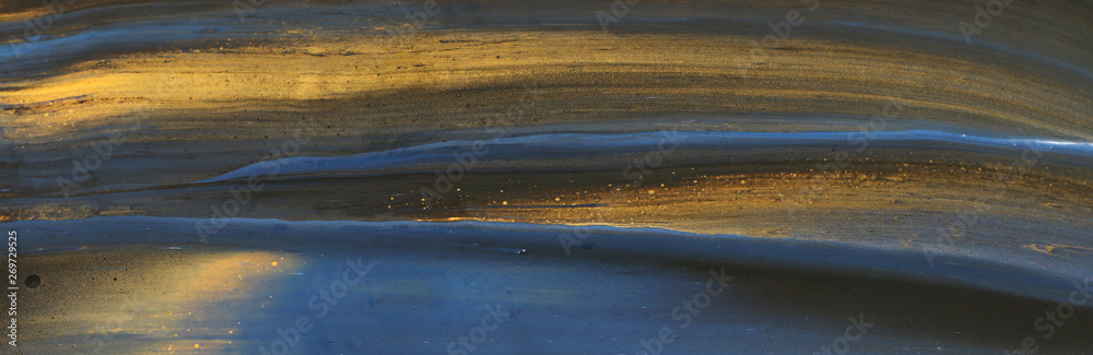 Abstract marbleized effect background. Blue and black creative colors. Beautiful paint with the addition of gold