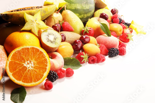 Fresh summer fruits with apple  peach  papaya  berries  pear and apricot.