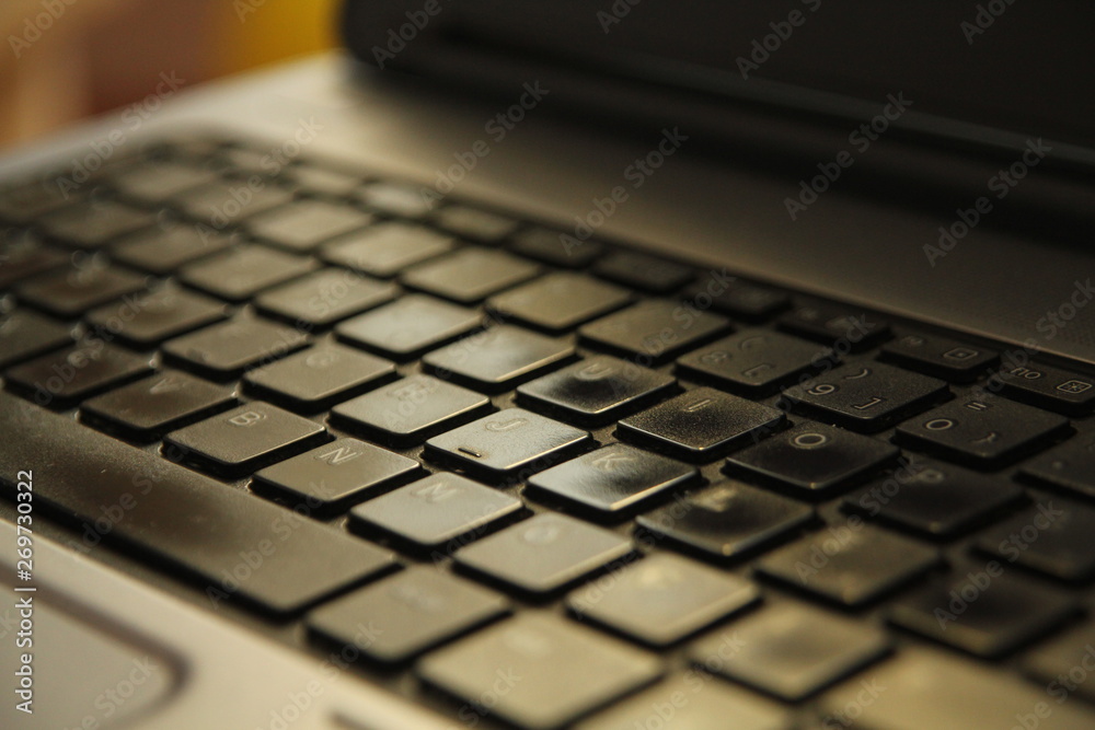typing on a laptop computer keyboard close up typing on a laptop computer keyboard close up