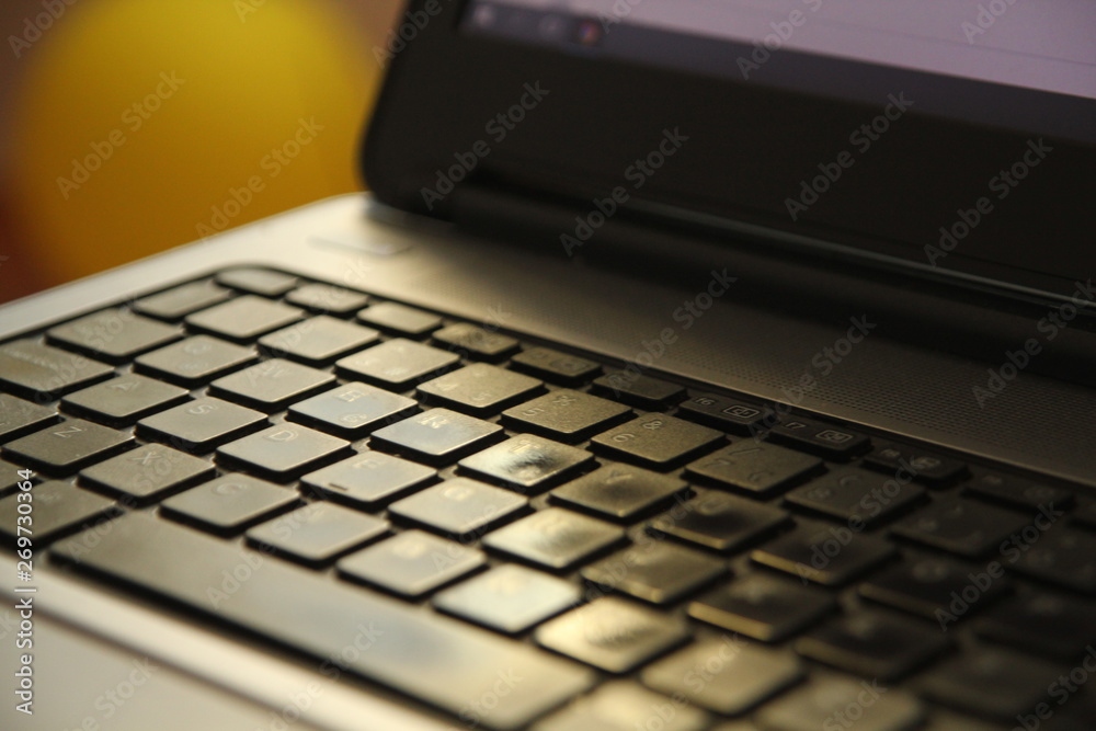 typing on a laptop computer keyboard close up typing on a laptop computer keyboard close up