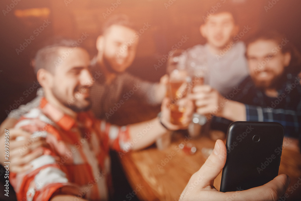 Selfie photo friends men hipsters in bar with beer at phone
