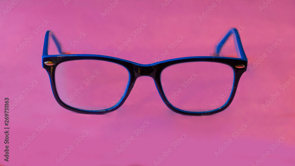 front view of glasses on pink background front view of glasses on pink background