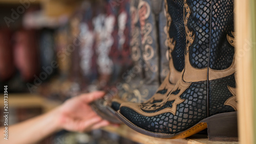 Bild auf Leinwand Selecting Cowboy Boots