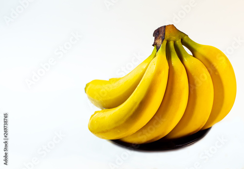 yellow bananas are lying on the table