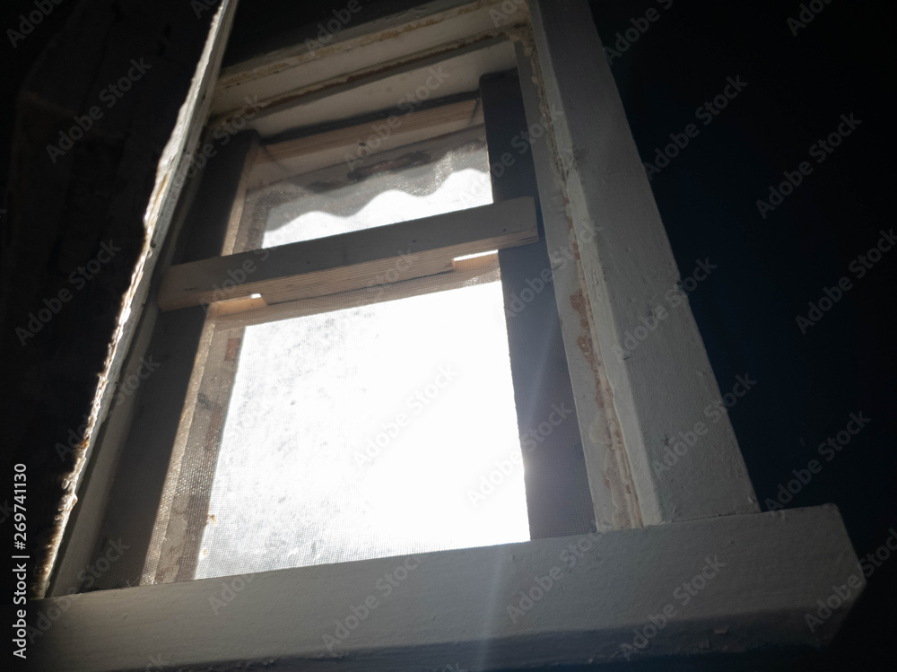 Light in the window. Sunbeam and old window. Light in the window. Sunbeam and old window.