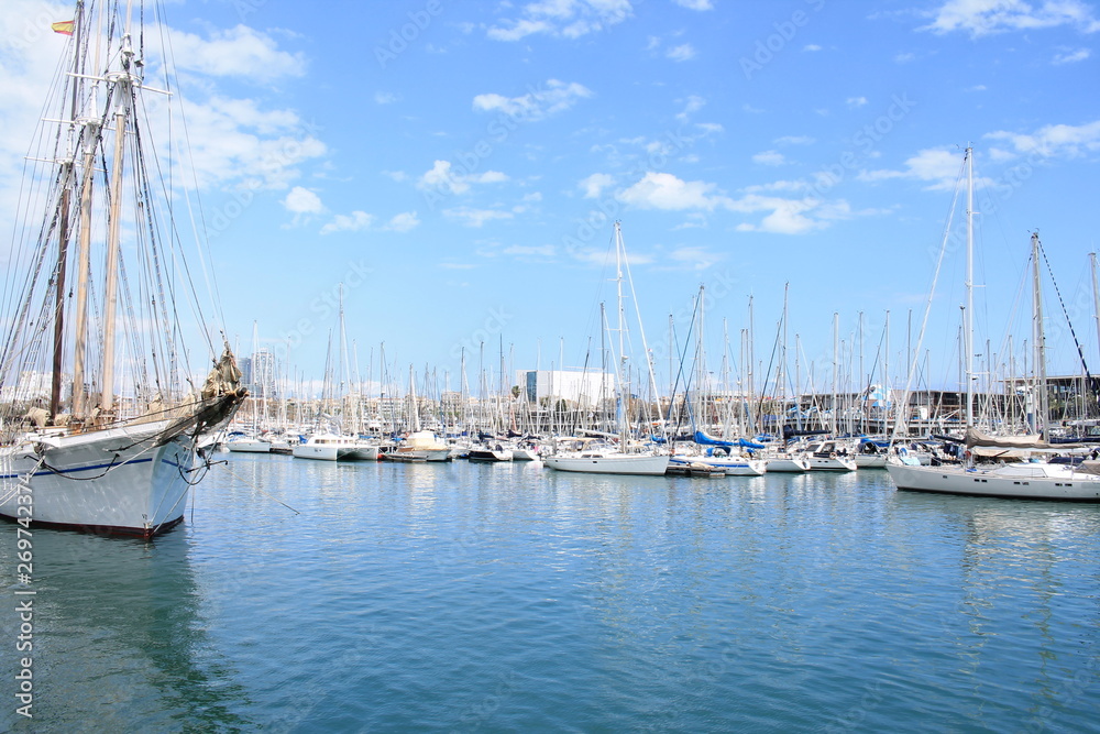 Fototapeta premium Sail boat in Marina Port Vell, a waterfront harbor in Barcelona, Catalonia, Spain