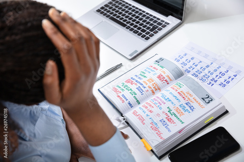 Stressed Businesswoman With Too Many Task To Do At Office photo