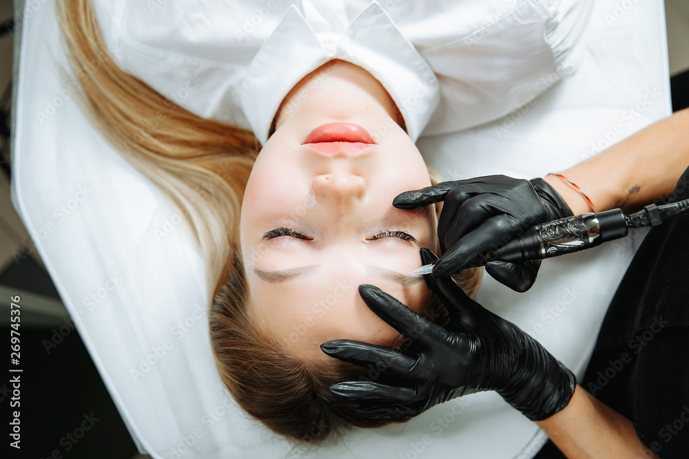 Professional wearing black gloves and holding speciality tool. Professional wearing black gloves and holding speciality tool.