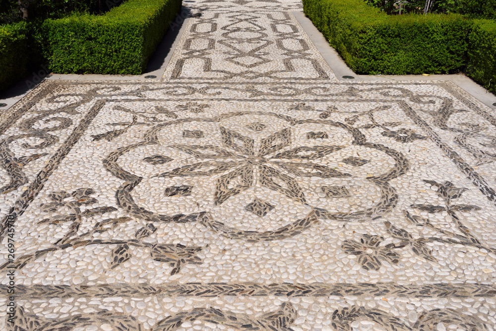 White stones from Darro river and black from Genil at San Francisco convent mosaic path Alhambra Granada