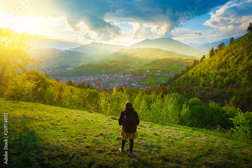 Girl travelling through beautiful epic mountain landscape