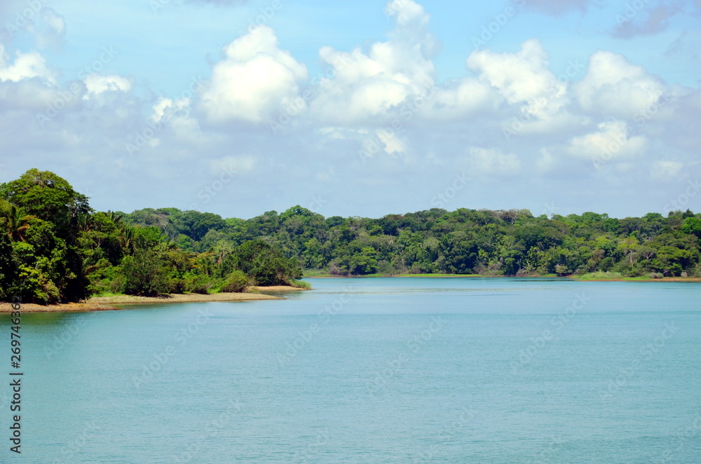 Green landscape of the Panama Canal, view from transiting container ship. Green landscape of the Panama Canal, view from transiting container ship.