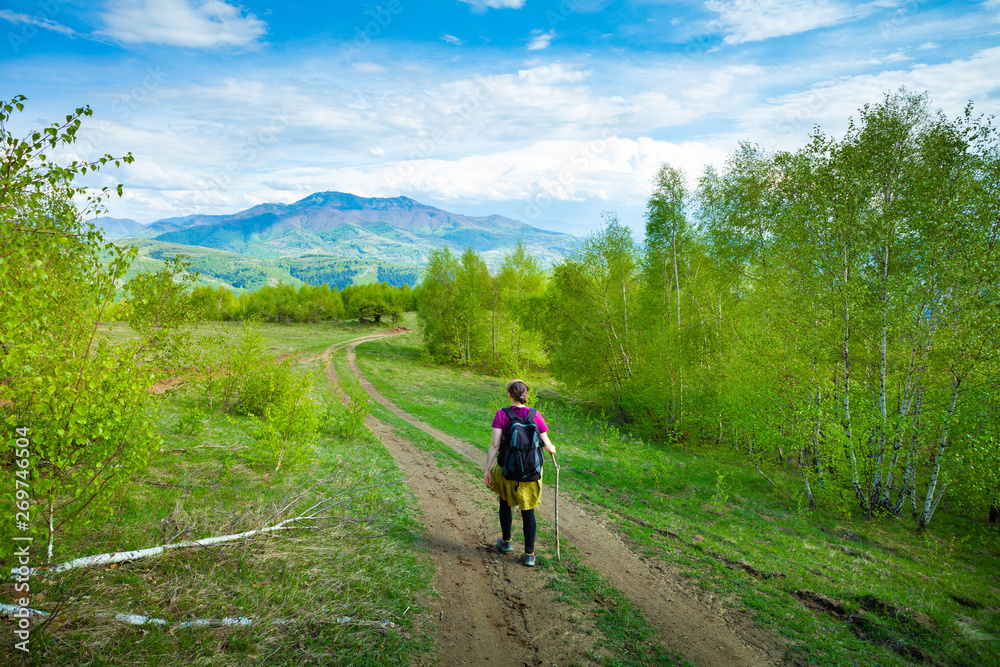 Girl travelling through beautiful epic mountain landscape Girl travelling through beautiful epic mountain landscape
