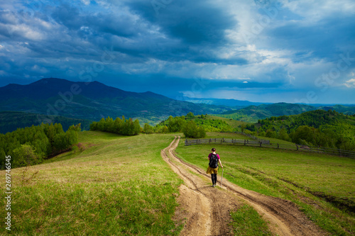 Girl travelling through beautiful epic mountain landscape