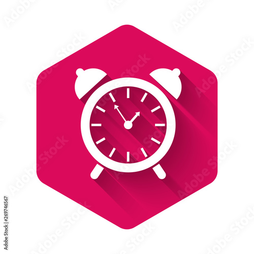 White Alarm clock icon isolated with long shadow. Wake up, get up concept. Time sign. Pink hexagon button. Vector Illustration