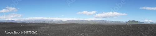 Solheimasandur plane wreck on Iceland in summer with blue sky and black beach