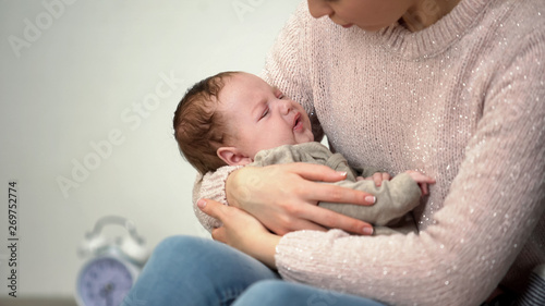 Photography Mom calming crying infant, problems with falling asleep, sleepless night