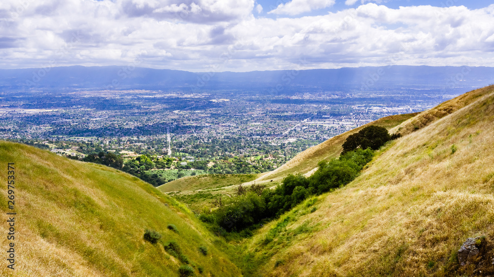 Aerial view of San Jose, part of Silicon Valley; golden hills visible in the foreground; South San Francisco bay area, California
