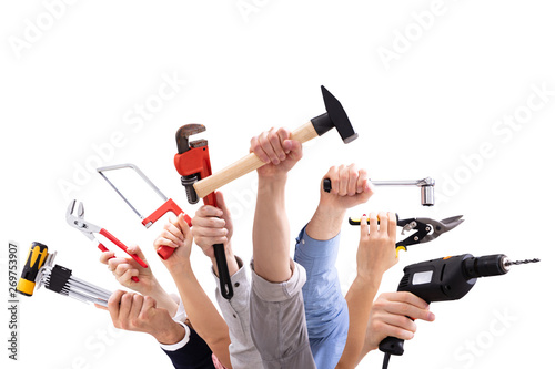 Group Of People's Hand Holding Carpentry Tools photo